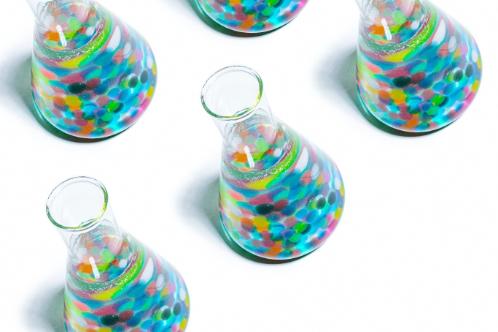 Colourful test tubes on a white surface