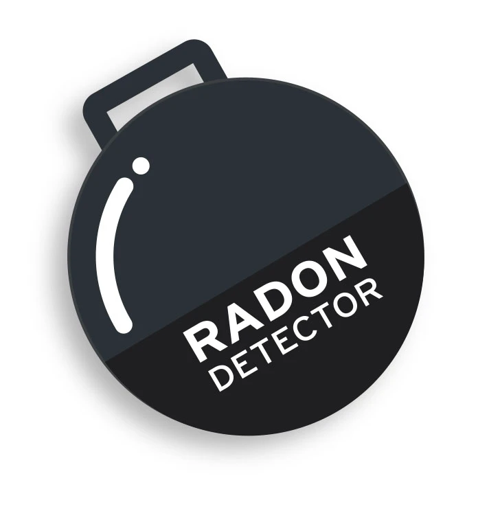 A radon detector; black round with white writing